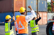 © NVB Stocker - Strike of workers in container yard. Group of multiethnic engineer people during a protest in workplace