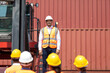 © NVB Stocker - Strike of workers in container yard. Group of multiethnic engineer people during a protest in workplace