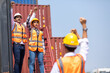 © NVB Stocker - Strike of workers in container yard. Group of multiethnic engineer people during a protest in workplace