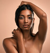 © peopleimages.com - Space, beauty and portrait of woman in studio for cosmetics, natural texture and cosmetology. Serious, salon and person with confidence for dermatology, spa aesthetic and skincare on pink background