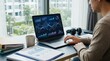 © Fridocha - Woman Working on Laptop Analyzing Financial Charts.