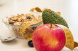 © tetxu - Bowl of cereal, apple, and avocado with measuring tape. Healthy and nutritious diet concept