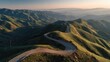 © Fayed - Winding road snakes through rolling green hills under soft sunrise light
