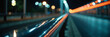 © AlenaSi - Night road with metal rail reflecting light, showcasing long streaks indicating speed and movement in urban setting.