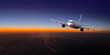 © Kornienko Alexandr - Airplane flying over city lights during sunset travel