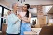 © peopleimages.com - New home, moving and woman with senior mother for help with boxes, furniture and unpacking. Retirement, homeowner and daughter with elderly mom for property, real estate investment and mortgage