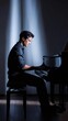© Lubos Chlubny - Pianist playing grand piano on stage at concert