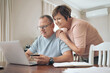 © peopleimages.com - Credit card, laptop and couple in home, smile and internet for investment payment. Happy, mature man and woman in lounge, pc and ecommerce with online shopping, banking and transactions for purchase