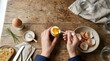 © Rusdiyanto - Top view of person eating soft boiled egg with spoon on rustic wooden table, healthy breakfast with toast and fresh herbs.