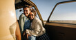 © Júlia Amaral - Two friends embrace inside a vintage van during a sunny road trip