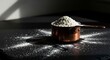 © Video2 - A Copper Measuring Cup Filled with Flour on a Dark Surface.