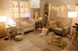 © Pixel-Shot - Interior of children's room with crib, sofa and glowing lamps in evening