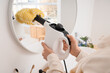 © Pixel-Shot - Woman steam cleaning mirror in bathroom