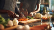 © Fox - Two people prepare fresh vegetables together in a modern kitchen, focusing on healthy cooking and teamwork. Natural sunlight highlights vibrant ingredients and culinary activity