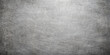 © MstAlea - Aged dark grey brushed metal texture with a grunge vintage pattern on a rough textured surface backdrop