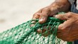 © 逊 陆 - Hands holding green fishing net