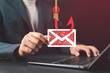 © Nirusmee - Phishing attack concept with man targeted by scam email on laptop, representing spoofing, fraudulent messages, cybersecurity risk, and online fraud awareness.