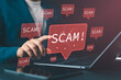 © Nirusmee - Online scam and internet fraud concept with scammer using laptop, representing malicious posts, fraudulent ads on social media, cybersecurity threats, and digital risk awareness.