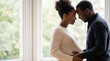 © Pei - Mother's Day pregnant couple forehead touching by window expressing intimate love connection for lifestyle magazine editorial photography