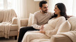 © Pei - Mother's Day expectant couple on sofa with husband touching belly showing love care warmth for parenting lifestyle magazine editorial content
