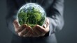© Nature Lens Studio - Businessman holding a transparent glass Earth sphere containing a lush forest, symbolizing green investment, ESG strategy, and sustainable leadership.