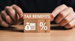 © ID006 - Tax benefits concept with wooden blocks, financial planning and tax deduction icons, person holding tax savings cubes on desk
