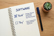 © Meow Creations - Open notebook displaying software build or buy strategic options with a pen on a wooden desk