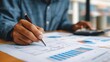 © Suriyo - business owner reviewing annual financial report