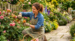 © Xenia - Smiling woman deadheading spent peach roses in a vibrant garden. Female gardener kneeling on a stone path pruning flowers with secateurs