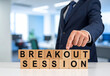 © magele-picture - Breakout Session - Geschäftsmann zeigt auf den Text 'Breakout Session'