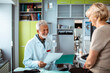 © Davor - Senior doctor discussing test results with elderly patient in clinic