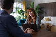 © ReeldealHD images - Businesswoman speaking in a meeting in a modern workplace