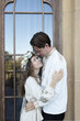 © Anna - beautiful, elegant, and happy bride and groom look at each other. A loving couple, a wedding, a tender moment. Emotions of happiness, love, and spiritual unity