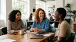 © utaem2022 - Diverse business women collaborating and laughing during meeting