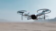 © Marina P. - Close up of modern drone hovering outdoors. Futuristic gray quadcopter with camera and spinning propellers. Minimalist composition with blurred background. Concept for technology and surveillance
