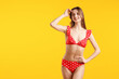 © New Africa - Beautiful woman wearing stylish swimsuit on yellow background. Space for text