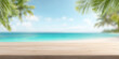 © GraysonStock - Wooden table on tropical beach background with palm leaves and blurred sea, summer product display