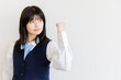 © Zoey106 - ガッツポーズで前向きな女子高生・挑戦と成功のイメージ