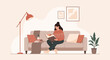 © prastowo - Cozy woman reading book on sofa, home relaxation, warm sweater, indoor lifestyle
