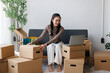 © David - Woman managing small business e-commerce orders from home