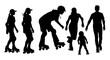 © Vextria - Family learning to skateboard together in silhouette at sunset with urban skyline background