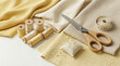 © Marina - Sewing accessories with fabric swatches thread spools wooden scissors pincushion and tape measure