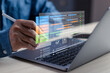 © PB Studio Photo - Businessman using digital project management dashboard with Gantt chart on laptop, planning workflow, tracking task, analyzing timeline for productivity, strategy, team collaboration in modern office