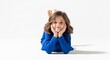 © prawiroz - Smiling girl lying down with hands on cheeks on white background