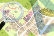 © Francesco Scatena - Plastic set square and magnifying glass over an imaginary General Urban Plan - 3D render concept image with copy space - note: the map is totally invented and does not represent any real place
