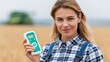 © OleksandrZastrozhnov - Young woman holding crop meter device in wheat field near combine harvester