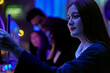 © ultramansk - Modern women in technology evaluating big data dashboards and predictive analytics. Tech expert monitoring privacy preserving AI models and autonomous systems with neon lights.