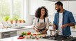 © An - A smiling Black man and woman are cooking together in a bright, modern kitchen. The woman wears an apron and is chopping vegetables on a cutting board while the man is stirring a pot on the stove.