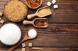 © New Africa - Different types of sugar on wooden table, flat lay. Space for text