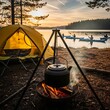 © Ragasa - Campfire boils kettle by tent, kayaks glide on serene lake at sunset